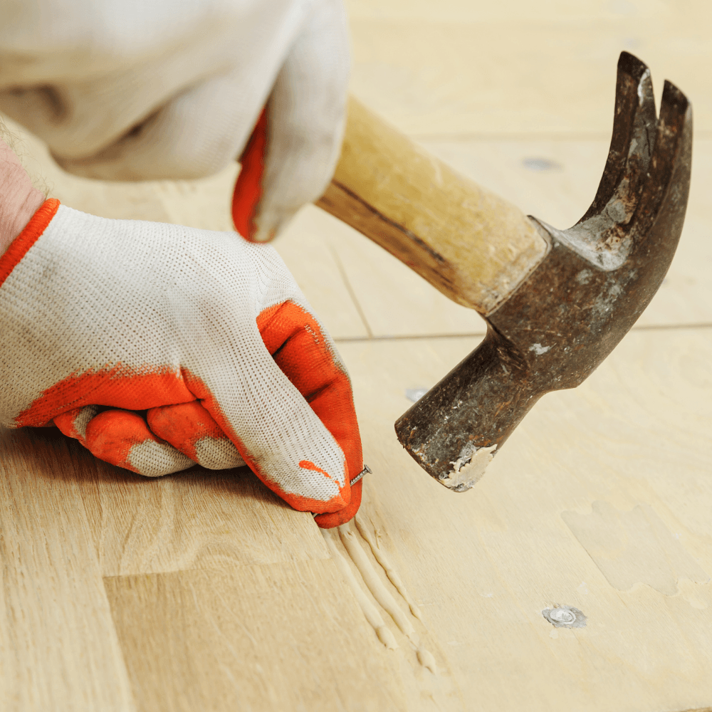 Pose de parquet massif collé
